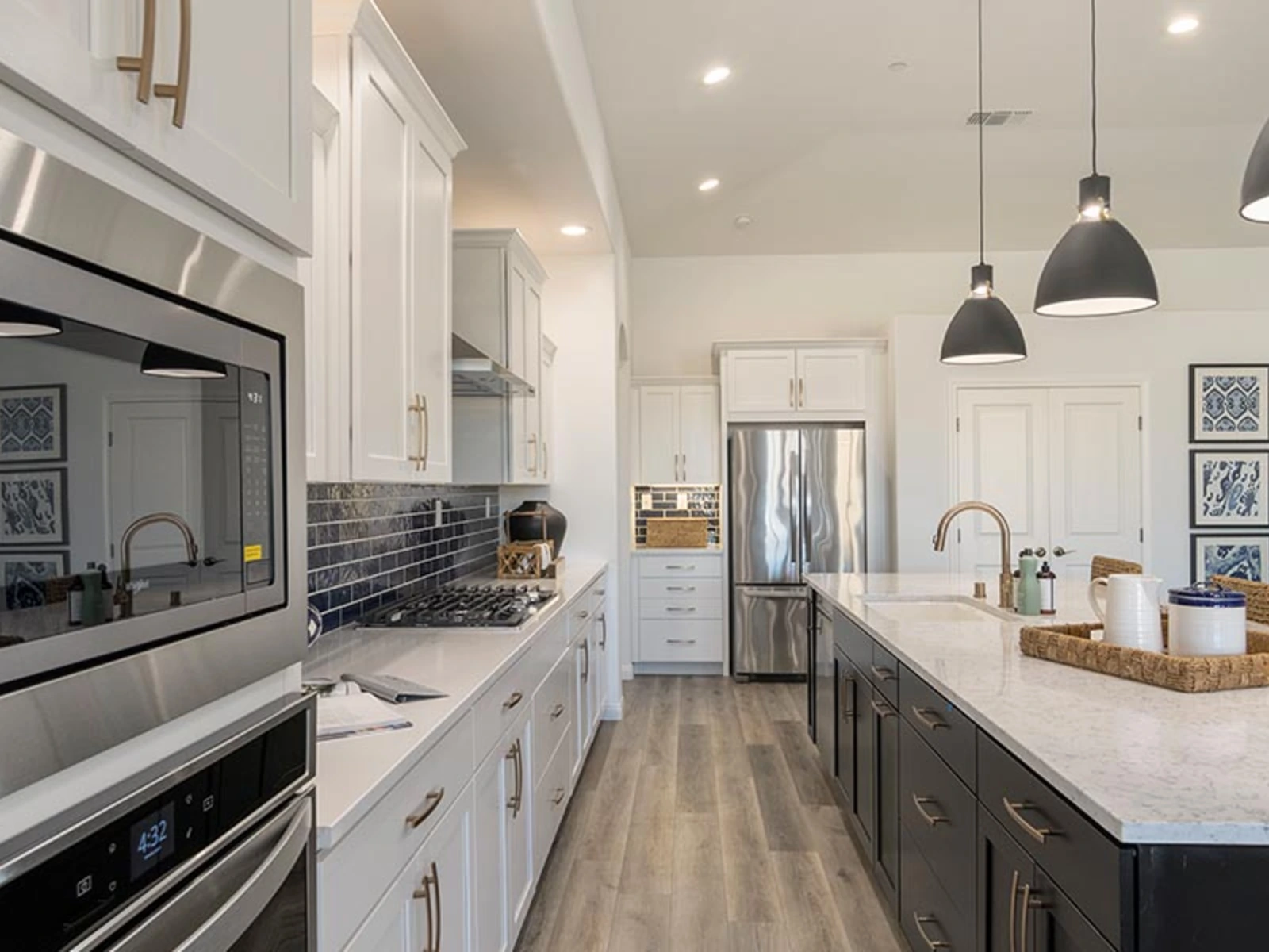 Kitchen with island, upgraded cabinetry and quartz counters in a Palmetto Estates home